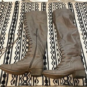 Knee high boutique boots.